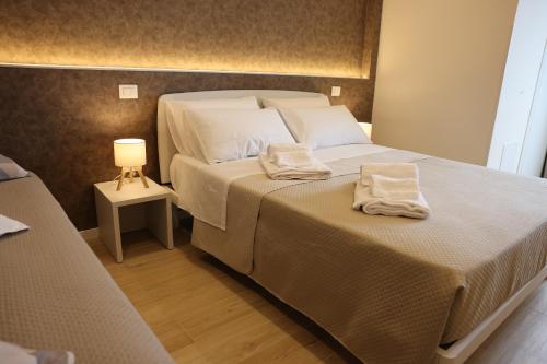 Postel nebo postele na pokoji v ubytování Le Barchette B&B