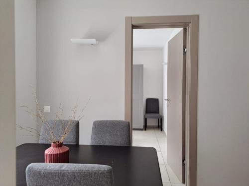 a dining room with a table and two chairs at Urban Residence by Quokka 360 - Apartments with parking in Lugano in Aldesago