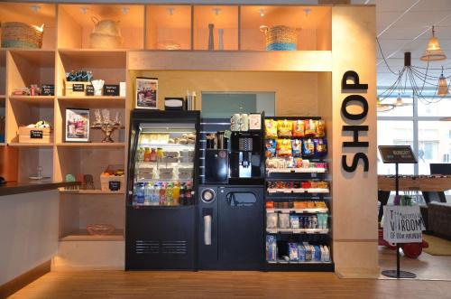 a store with a black refrigerator in a store at Scandic Kista in Stockholm