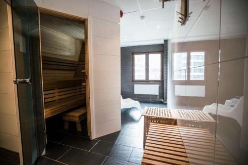 a bathroom with a sink and a shower in a room at Scandic Kista in Stockholm