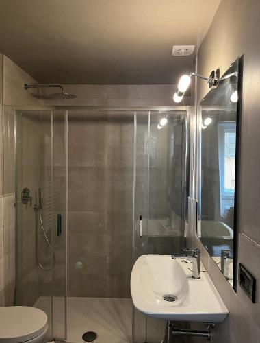 a bathroom with a sink and a shower at Fashion Florence Rooms in Florence