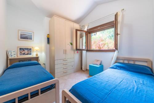 Ένα ή περισσότερα κρεβάτια σε δωμάτιο στο Villa L'ulivo