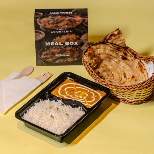 a meal box and rice and a basket of food at Stay Studio Hotel & Residences in Gurgaon