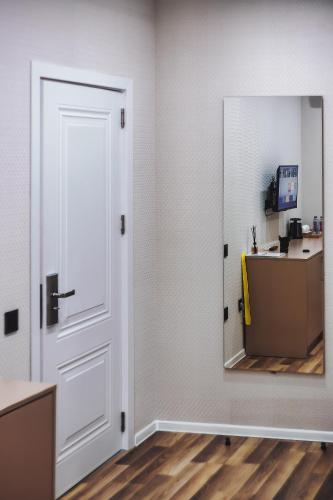 an empty room with a door and a mirror at Hillside Boutique Hotel Baku in Baku