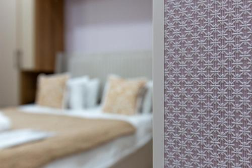 a close up of two beds in a room at Hillside Boutique Hotel Baku in Baku