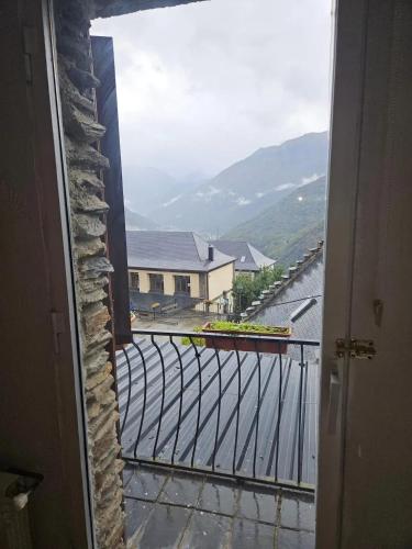 a view from an open door of a balcony at Spacious House in Canejan with Mountain View in Caneján