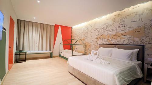 Postel nebo postele na pokoji v ubytování OS Style Hotel Batam Centre