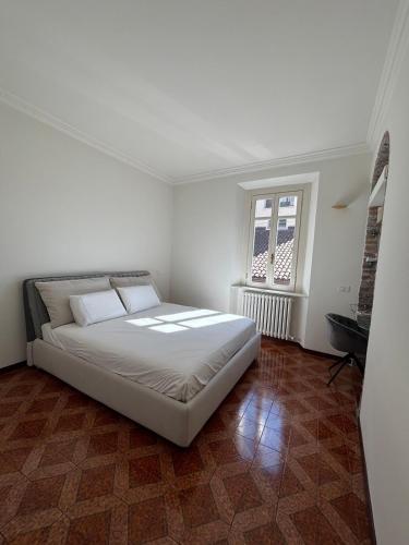 a bedroom with a large bed in a room at IlNanoaComo, HolidayApartment in the Heart of Como in Como