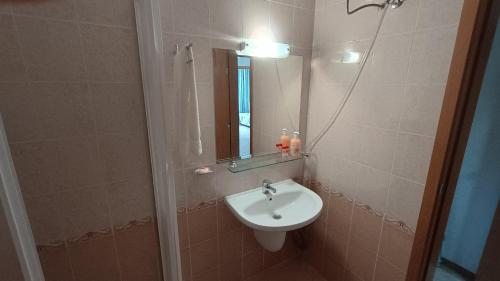a bathroom with a sink and a mirror at Excelsior Prince ApartHotel in Sunny Beach