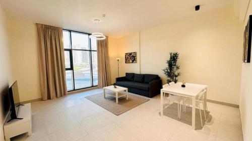a living room with a couch and a table at Luxurious apartments at JLT by Checkmyguest in Dubai