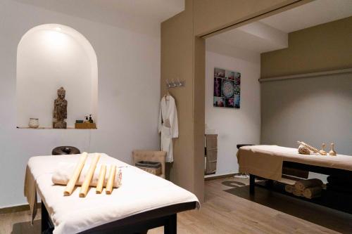 a room with two beds with baseball bats on it at Hotel Planas in Salou