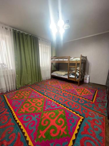 Postel nebo postele na pokoji v ubytování Chyngyz Traditional Guest House