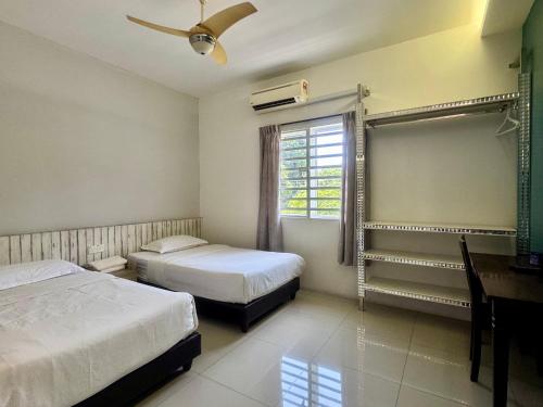 Ένα ή περισσότερα κρεβάτια σε δωμάτιο στο Lavender house IPOH