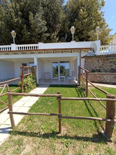 a house with a fence in front of it at B&b Il Leccio in Subiaco