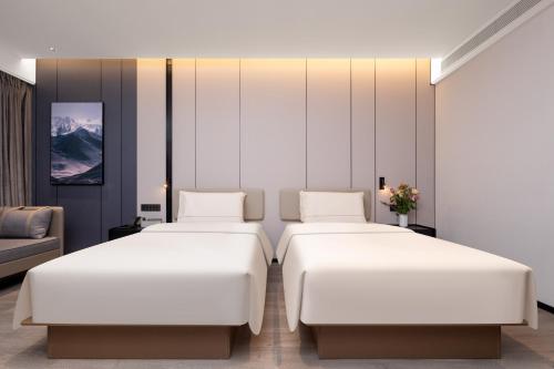 Cama o camas de una habitación en Atour Hotel Wenling Zeguo Lingyue Plaza