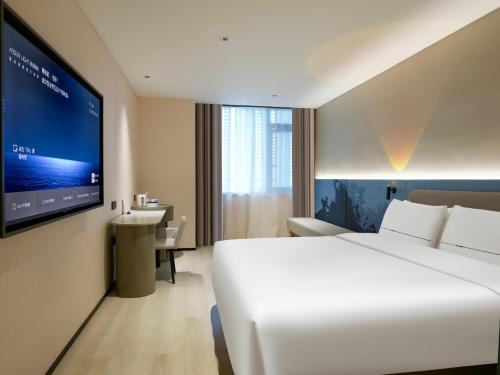 Cama o camas de una habitación en Atour Light Hotel Suzhou Guanqian Street Chayuanchang Subway Station