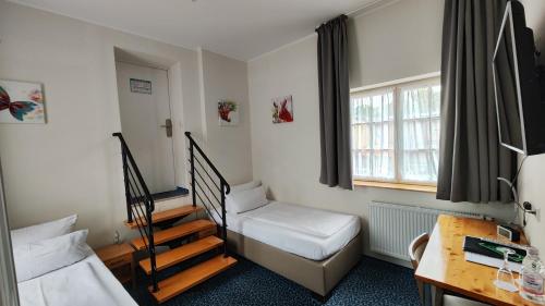 Postel nebo postele na pokoji v ubytování Hotel Alte Brennerei