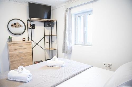 Una cama o camas en una habitación de Cycladic House Naxos