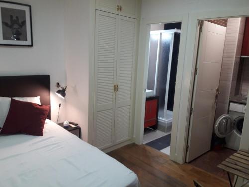 En eller flere senge i et værelse på Exyca Chueca