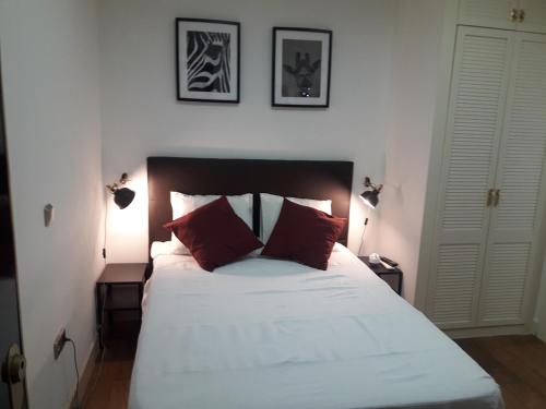 En eller flere senge i et værelse på Exyca Chueca