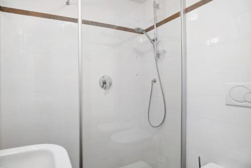 a shower with a glass door in a bathroom at Agritur La Gemma in Sant'Orsola Terme