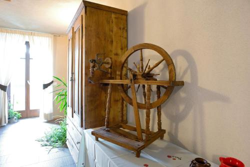 a large wooden object sitting on a shelf in a room at Agritur La Gemma in Sant'Orsola Terme