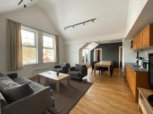 a living room with a couch and a table at Hovdestøylen Apartments in Hovden
