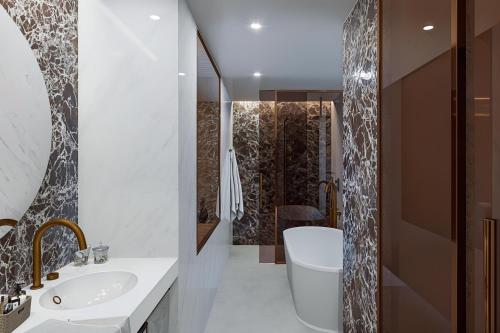 a bathroom with a toilet and a sink and a shower at Sol Torremolinos - Don Pablo in Torremolinos