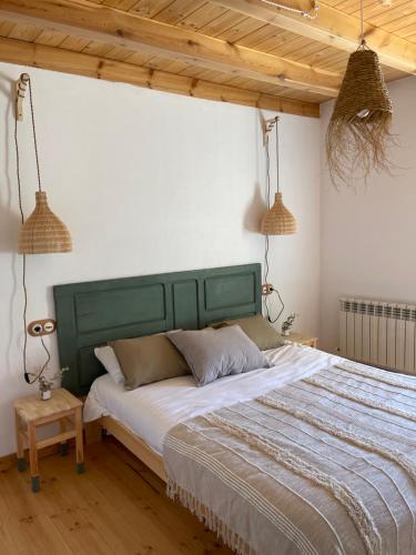 Ένα ή περισσότερα κρεβάτια σε δωμάτιο στο La Casita de la Ribera