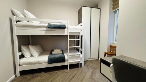 Ένα ή περισσότερα κρεβάτια σε δωμάτιο στο Apartment Bllok A