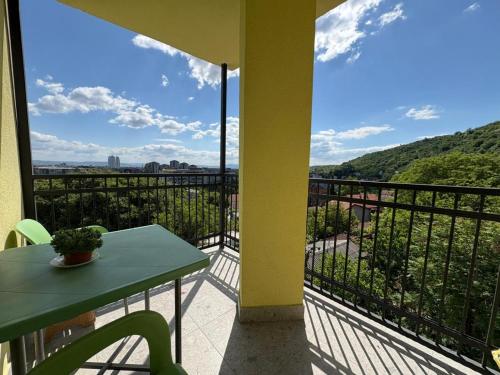a balcony with a table and a view at Family Apartment in Skopje