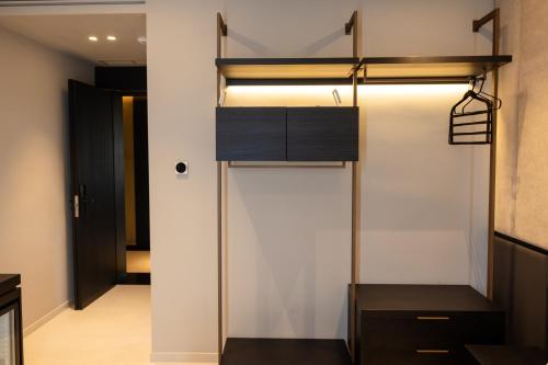 a room with a loft bed and a hallway at Hotel Majestic in Vlorë