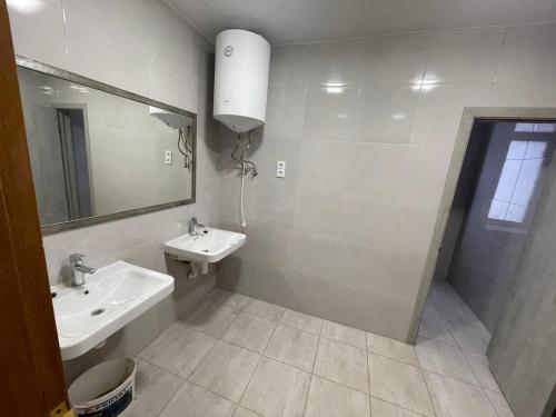 a bathroom with a sink and a mirror at uaHOSTEL in Kyiv