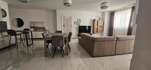 a living room with a couch and a table at Central Apartment Sliema John in Sliema