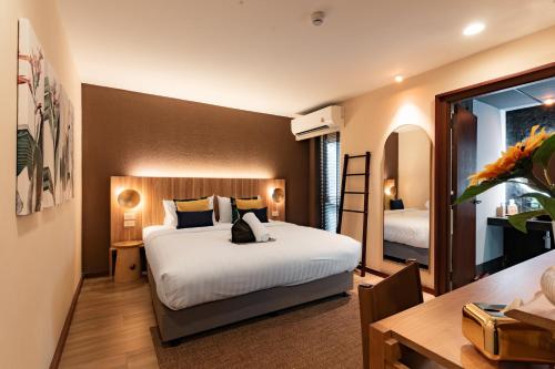 Postel nebo postele na pokoji v ubytování Mybed Chonburi