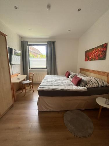 Postel nebo postele na pokoji v ubytování Ferienwohnung Alte Volksbank Nauendorf