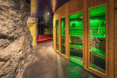 a hallway with green lights in a building at Le Clervaux Boutique Hotel & Spa in Clervaux