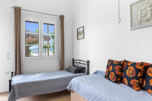 Ένα ή περισσότερα κρεβάτια σε δωμάτιο στο Haraki Sand Beach