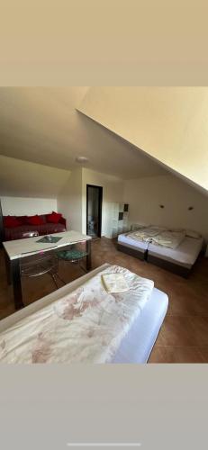 a room with two beds in a room at Vinný sklípek s ubytováním in Bořetice