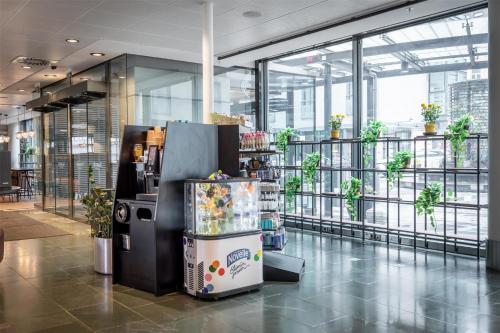 a vending machine in the middle of a building at Scandic Simonkenttä in Helsinki