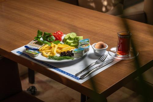 a plate of food on top of a table at Berrak Su Hotel in Antalya