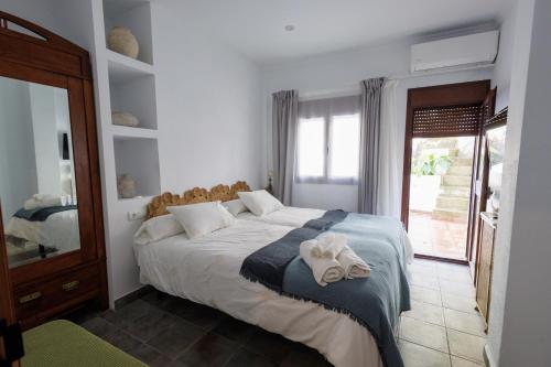 Кровать или кровати в номере La Casa del Risco Zahara