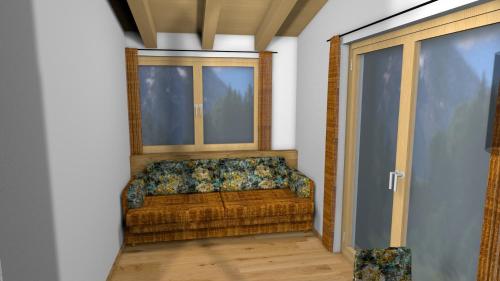 a couch in a room with a window at Boderhof Apartments in Tux