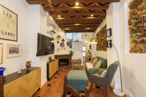 Телевизор и/или развлекательный центр в La Casa del Risco Zahara