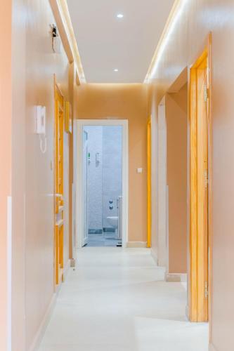 an empty hallway in a house with a bathroom at Appart hotel tanger in Dakhla