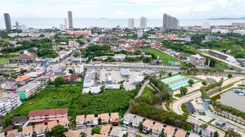 an aerial view of a city with buildings at The Orange House Pool Villa Pattaya in Jomtien Beach