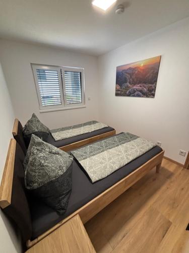 Postel nebo postele na pokoji v ubytování Resort Winklfeld 6a