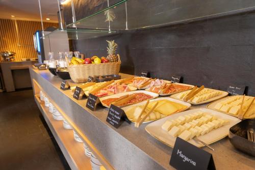a buffet with many different types of food on a table at HM Jaime III in Palma de Mallorca