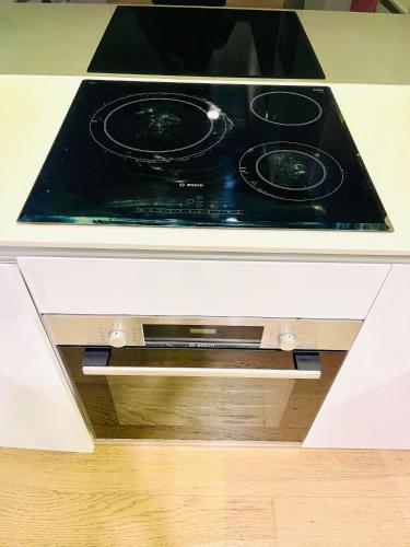 a stove top oven sitting on top of a kitchen counter at My Residence Villa Star Klcc in Kuala Lumpur