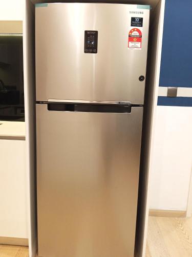 a stainless steel refrigerator in a kitchen at My Residence Villa Star Klcc in Kuala Lumpur